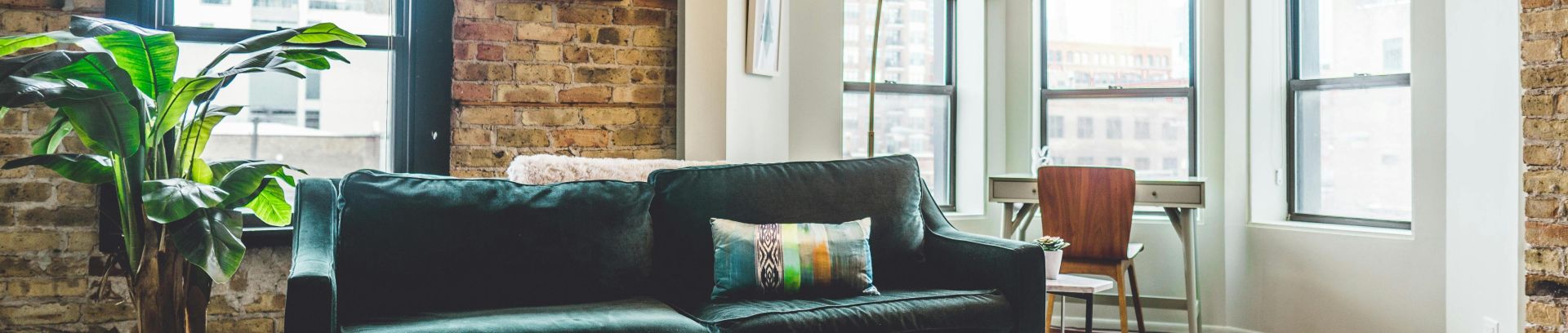 Contemporary living room with elegant decor and cozy furniture in urban setting.